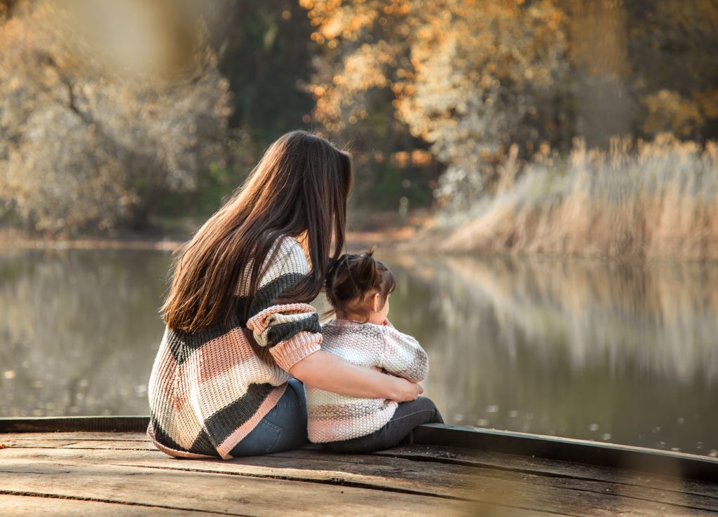 mom with little daughter autumn forest